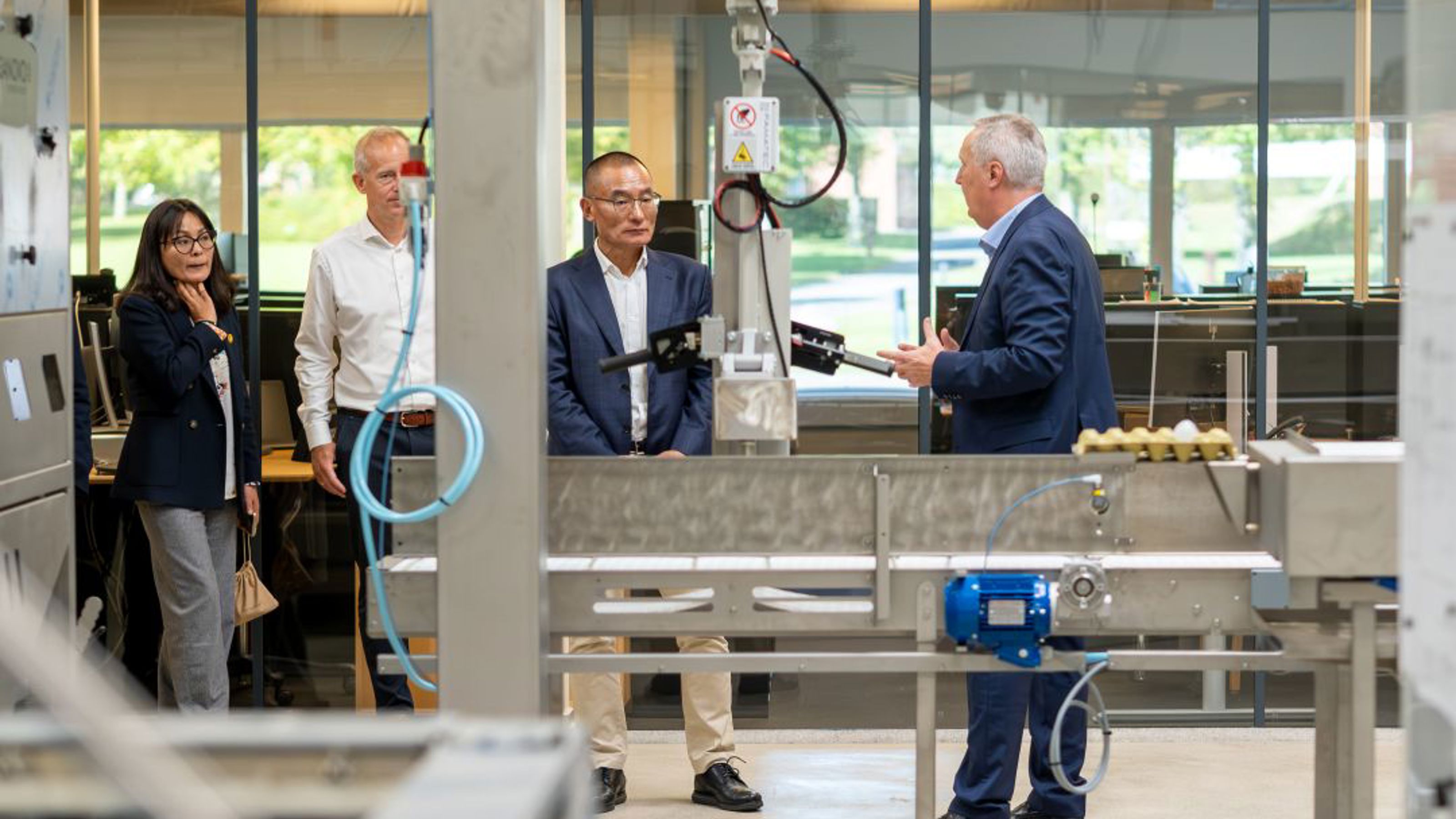 Bhutan’s Prime Minister touring SANOVO TECHNOLOGY GROUP’s factory with company leadership.