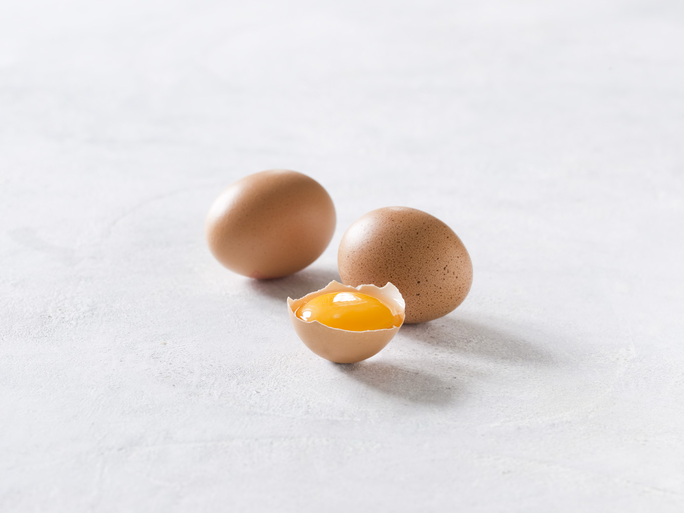 Egg yolk in shell with eggs