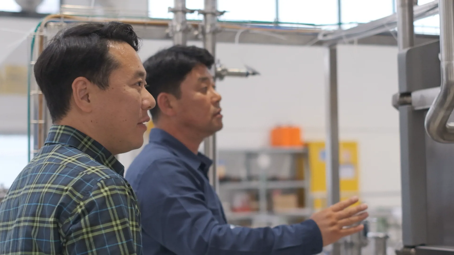 Two people at SANOVO customer site in the Korean market.