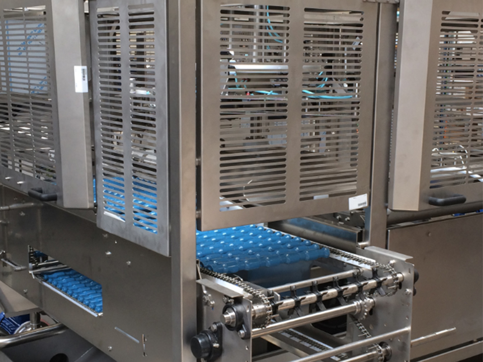 Roller conveyor section inside the OptiLoader Plus 6C egg loading machine by SANOVO TECHNOLOGY GROUP.