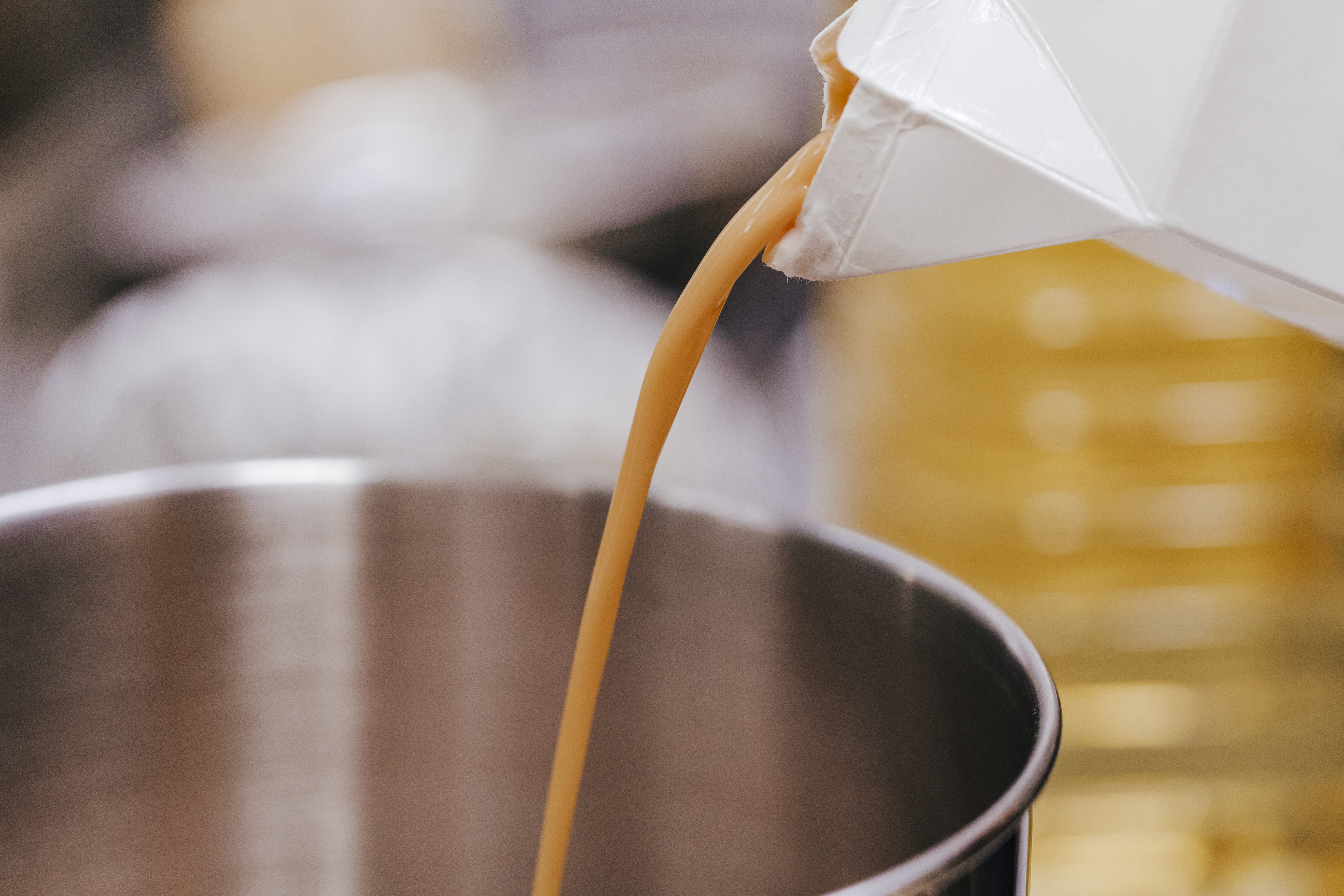 Liquid egg being poured in a bowl.