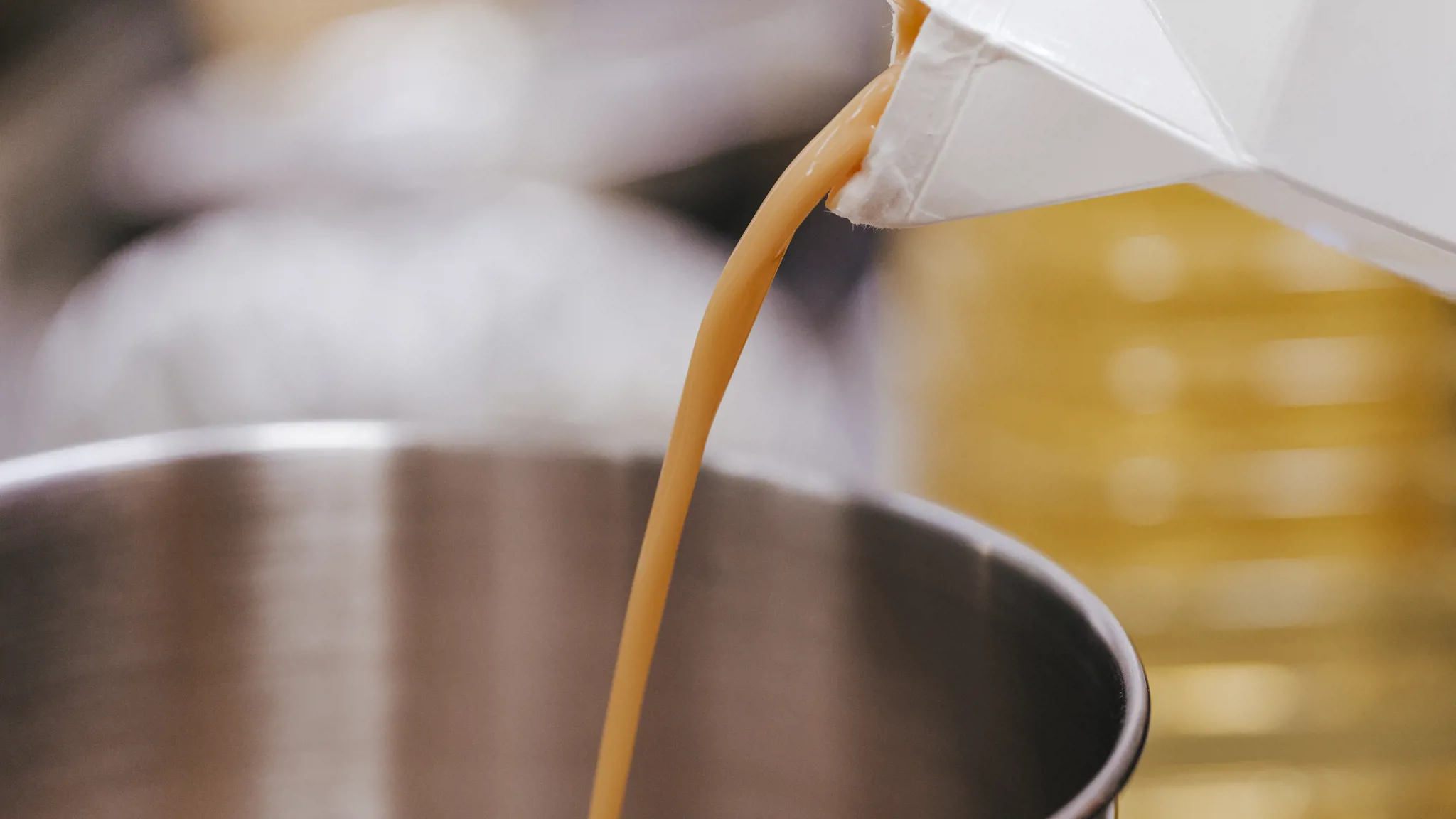 Liquid egg being poured in a bowl.