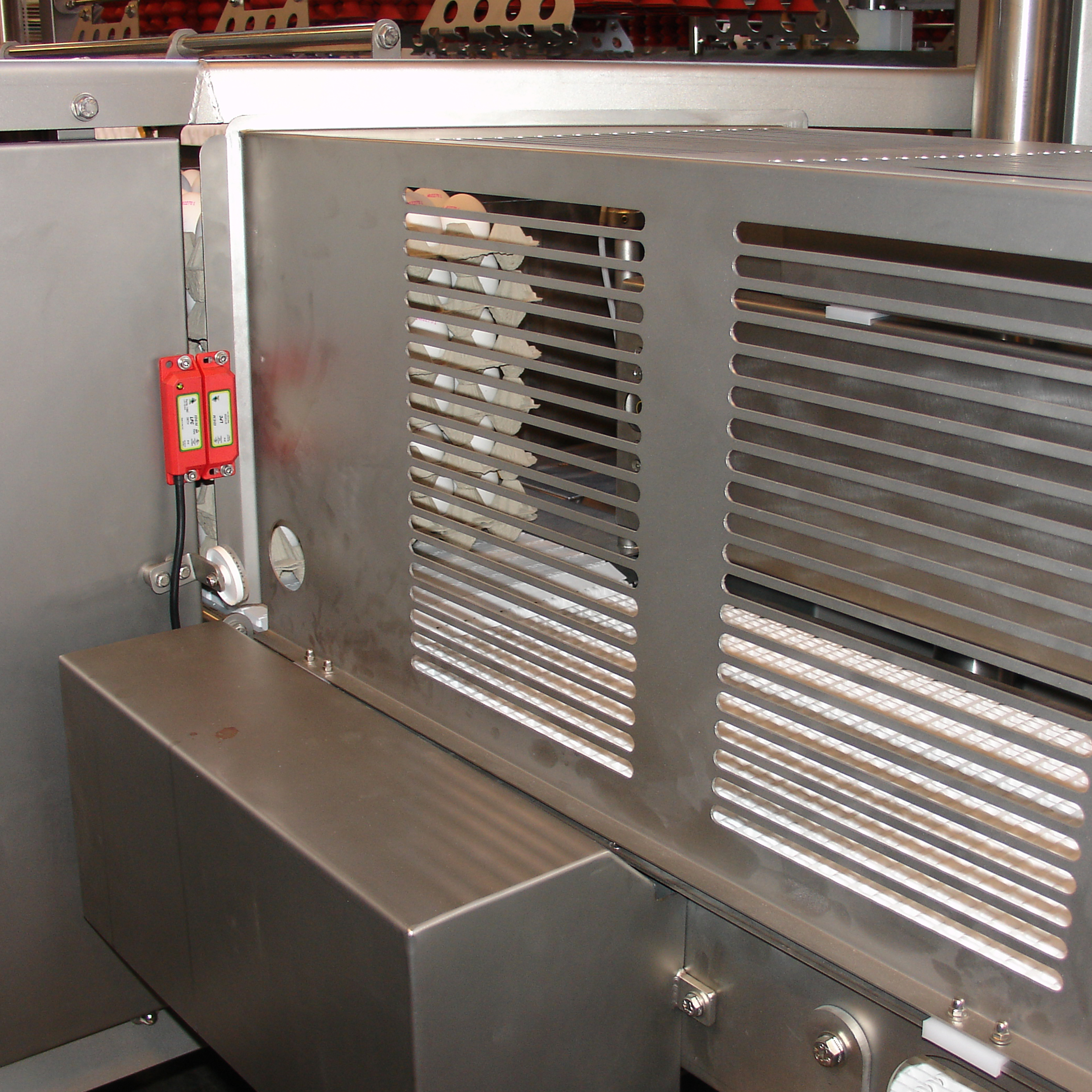 Safety system and protective guarding on a SANOVO OptiLoader machine.