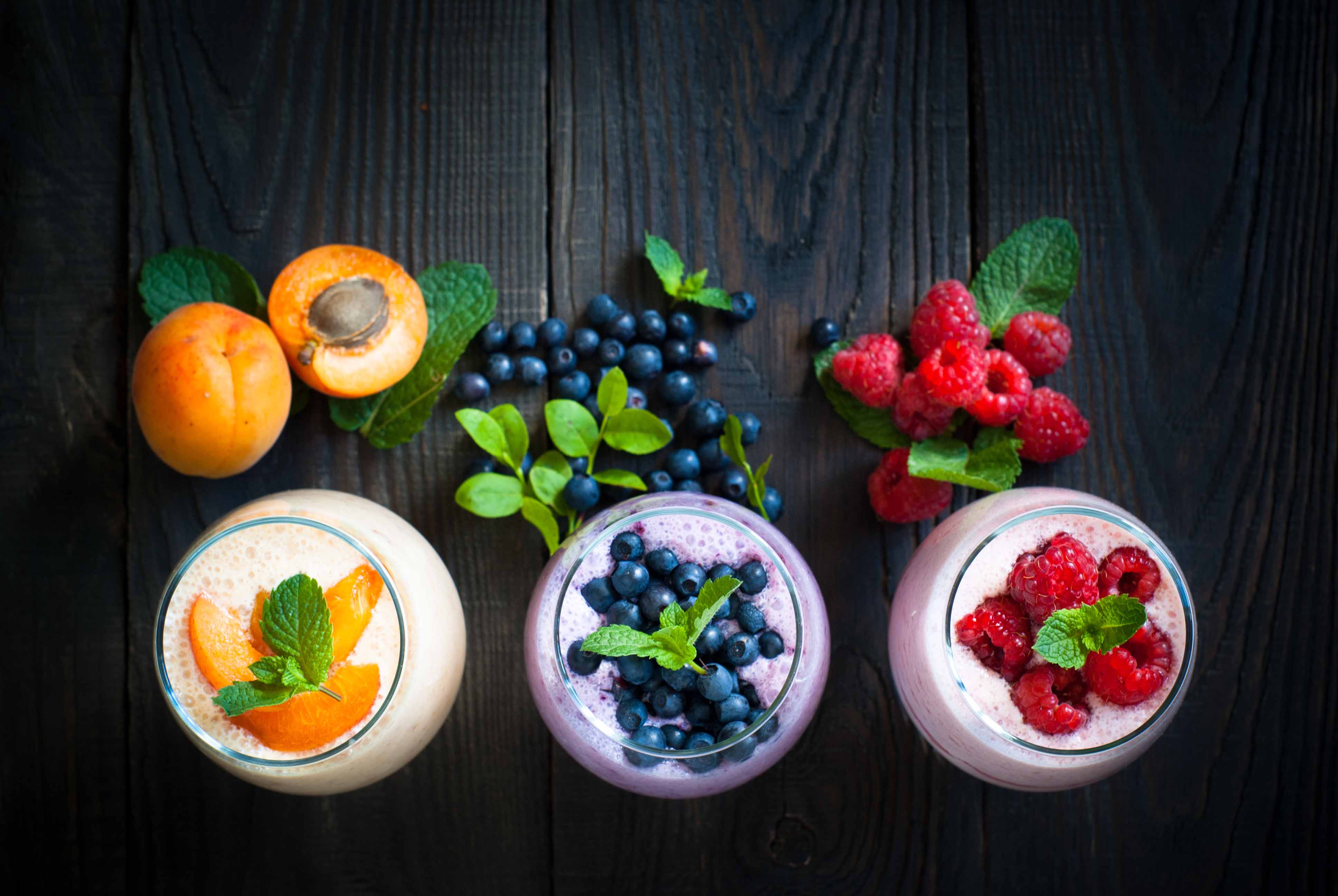 Fruit yogurt and smoothies with apricot, blueberry, and raspberry