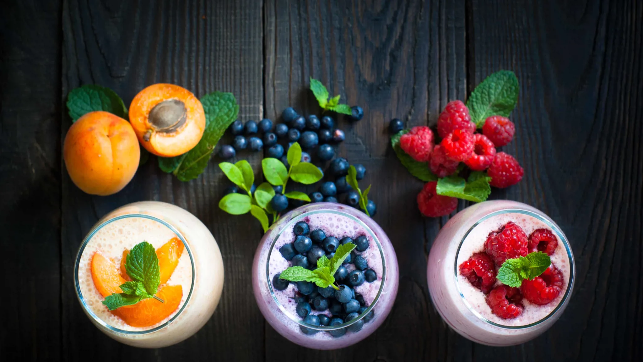 Fruit yogurt and smoothies with apricot, blueberry, and raspberry