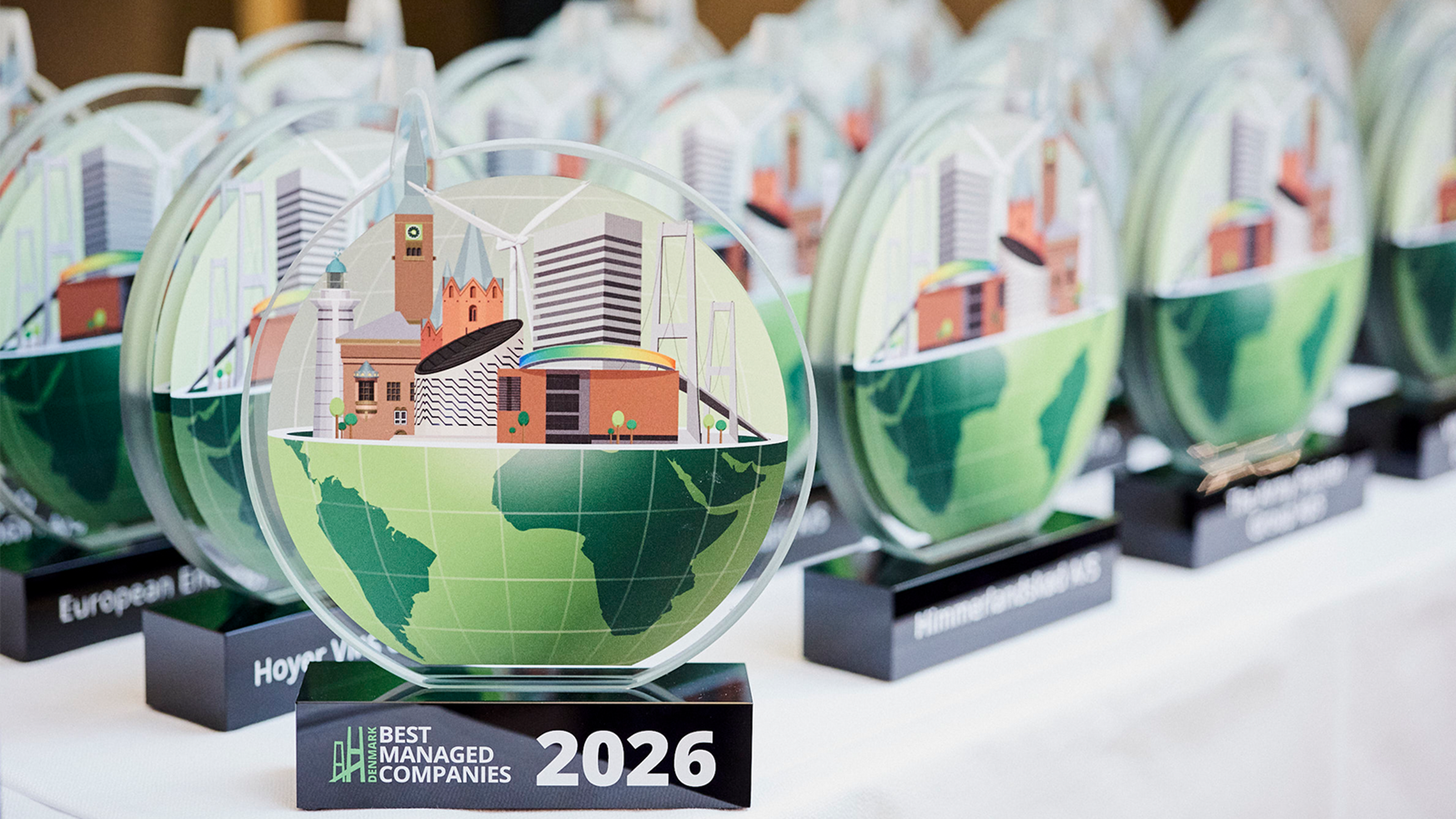 Best Managed Company Award 2026 statuettes on a table.