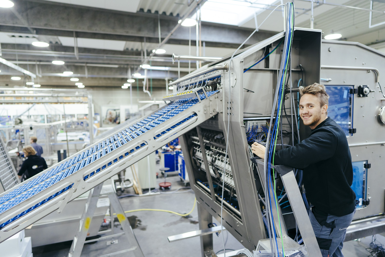 Production worker assembling an egg processing machine at SANOVO TECHNOLOGY GROUP