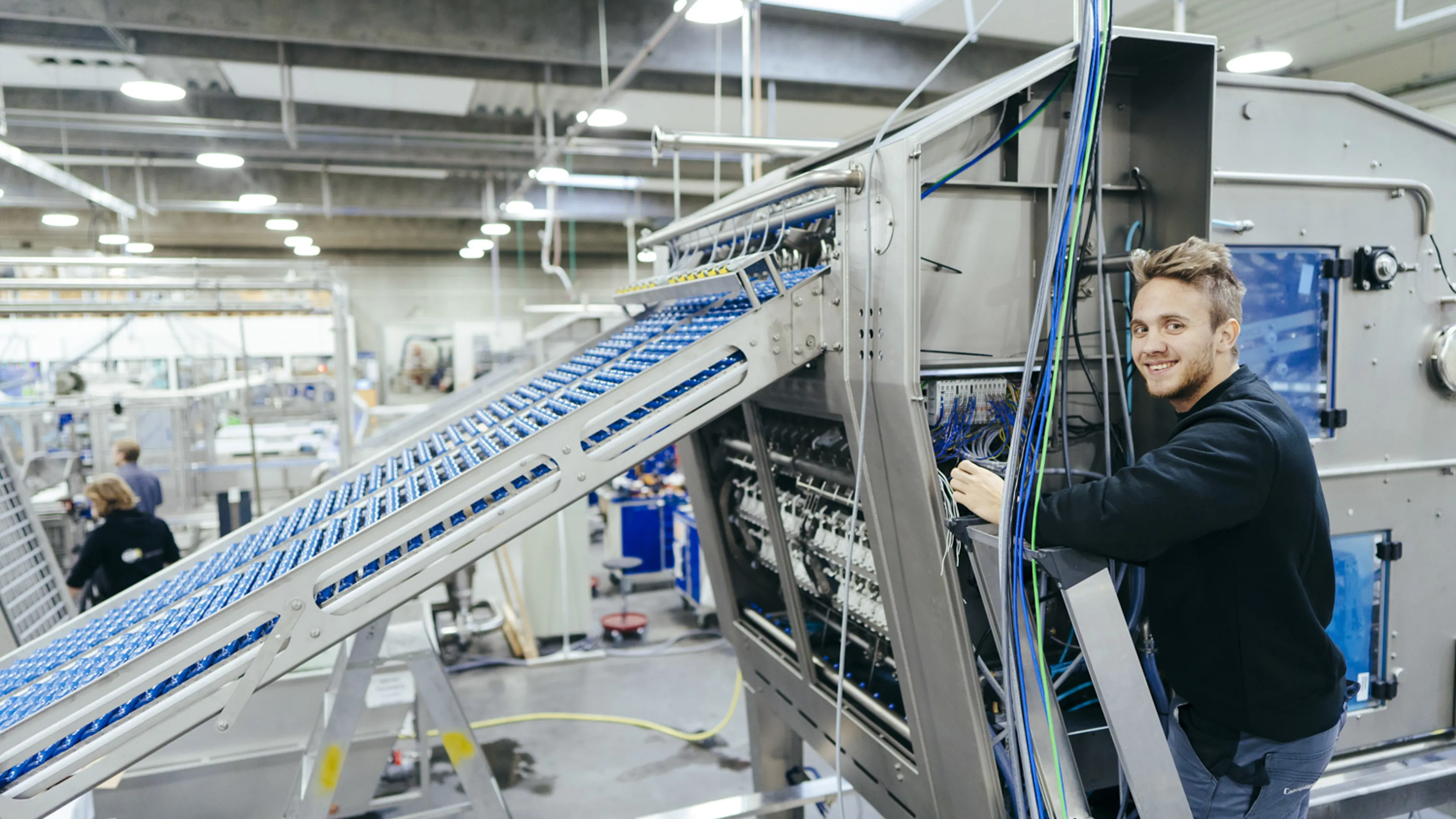 Production worker assembling an egg processing machine at SANOVO TECHNOLOGY GROUP