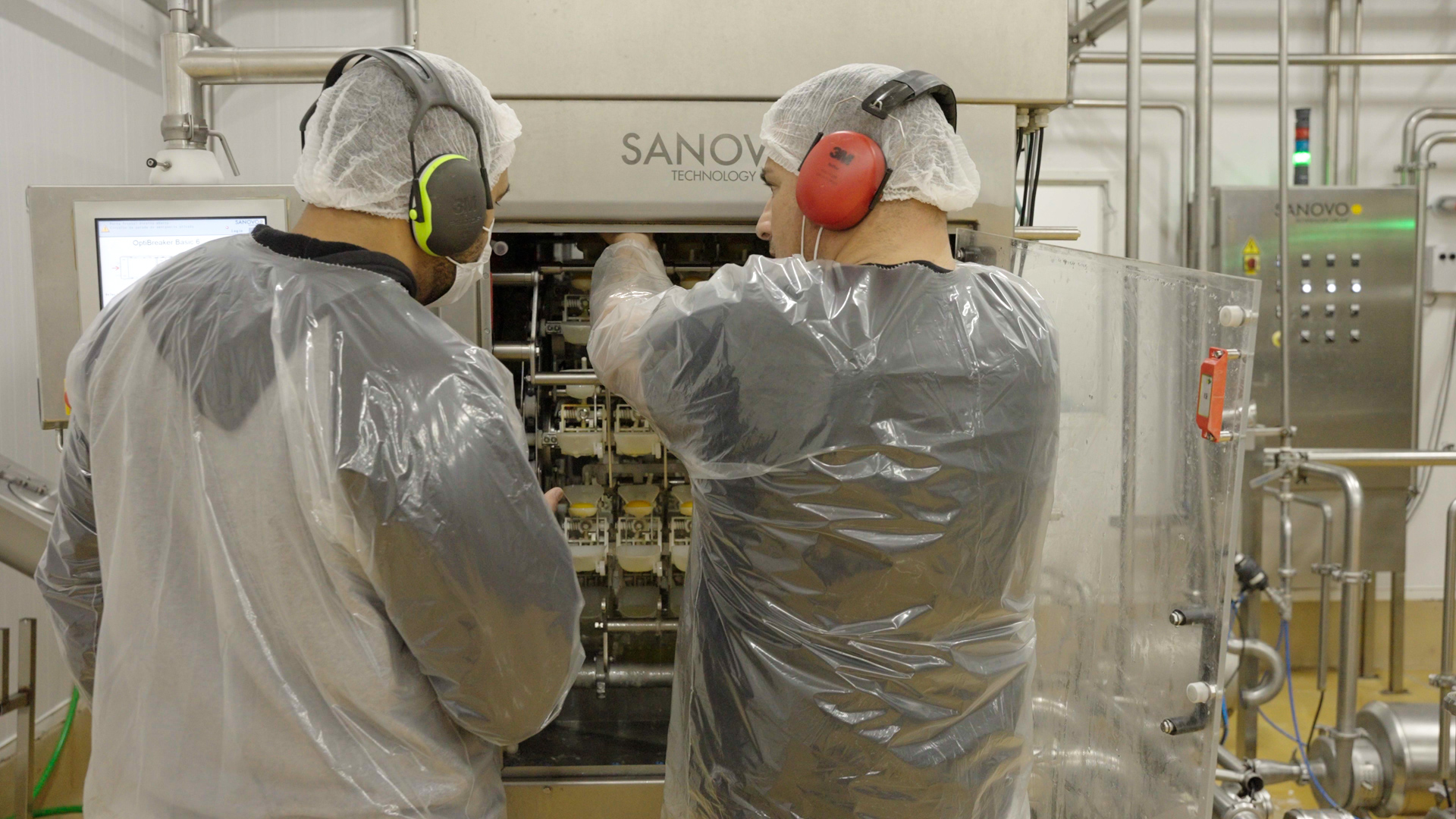 Technicians at Master Eggs in Brazil operating SANOVO egg processing equipment