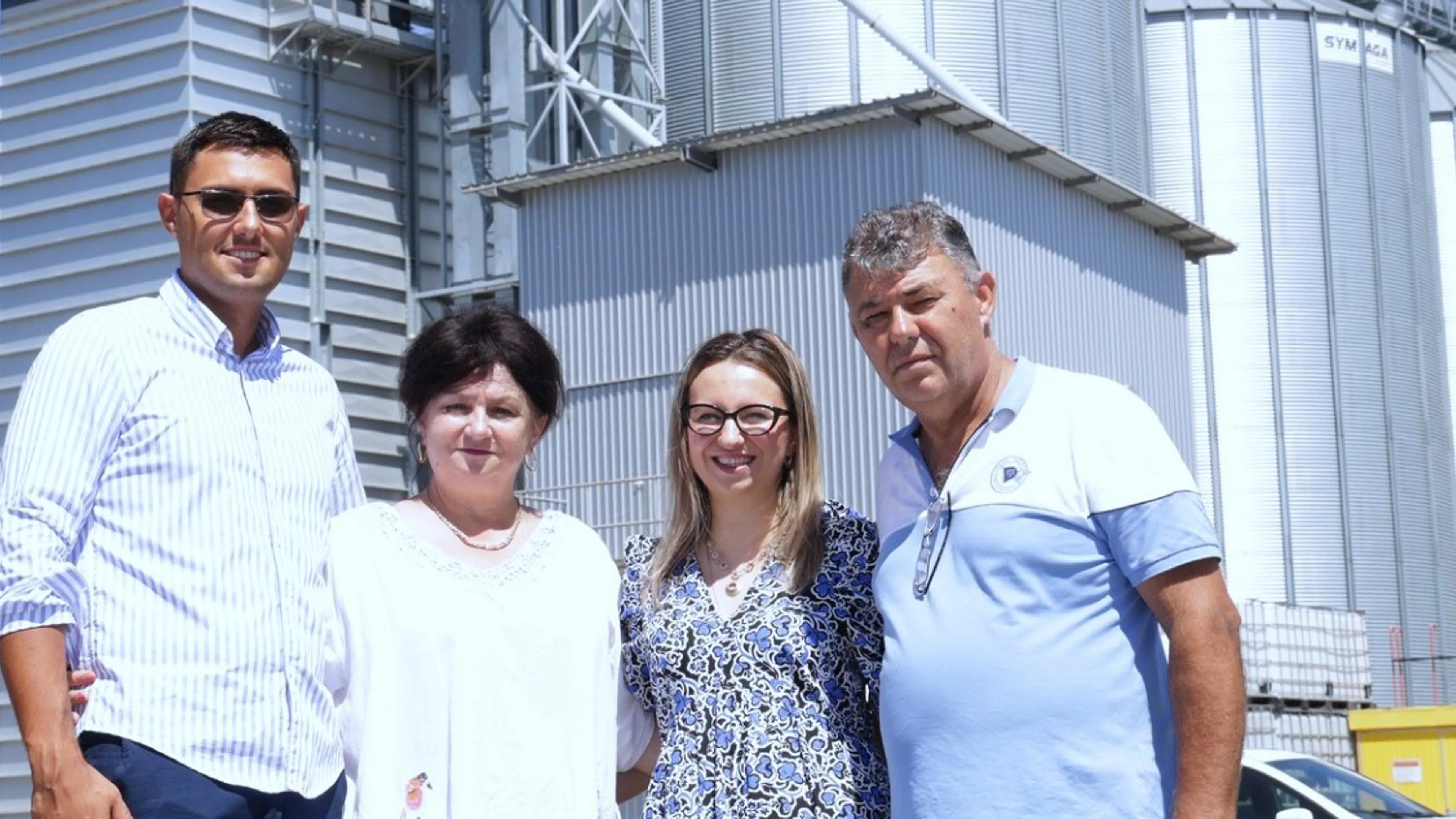 Rakic Komerc team standing in front of egg production facility.