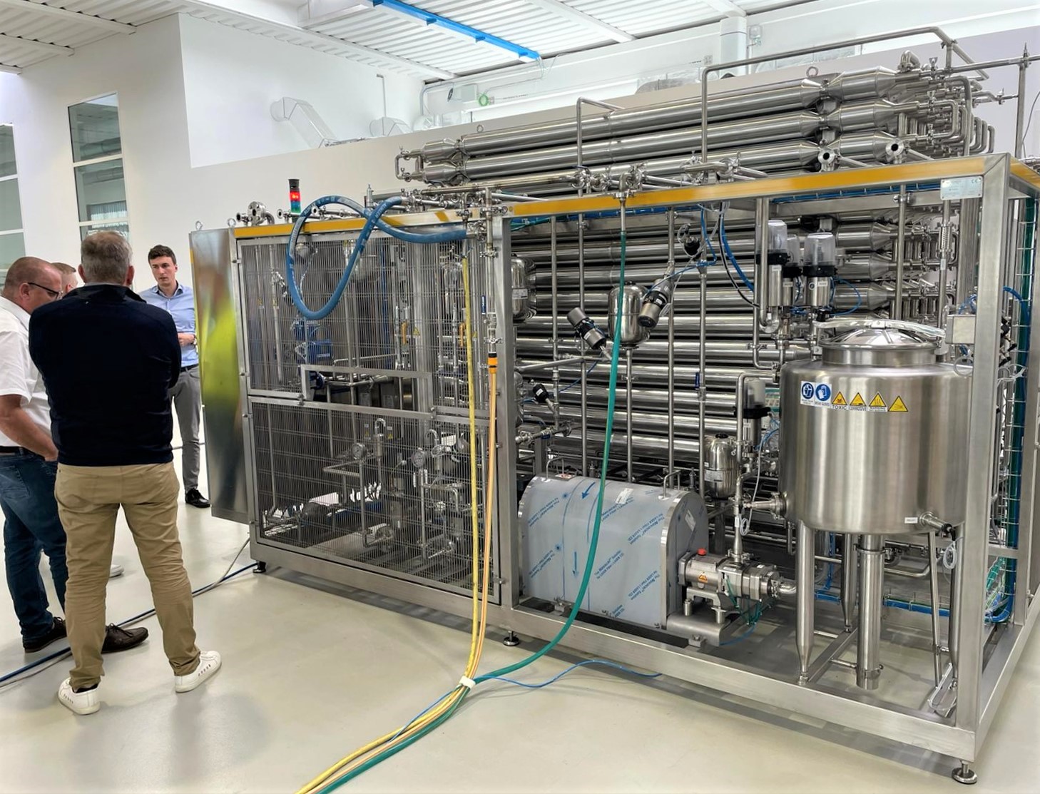 Training session on SANOVO WAVE pasteurization equipment with operators on site.