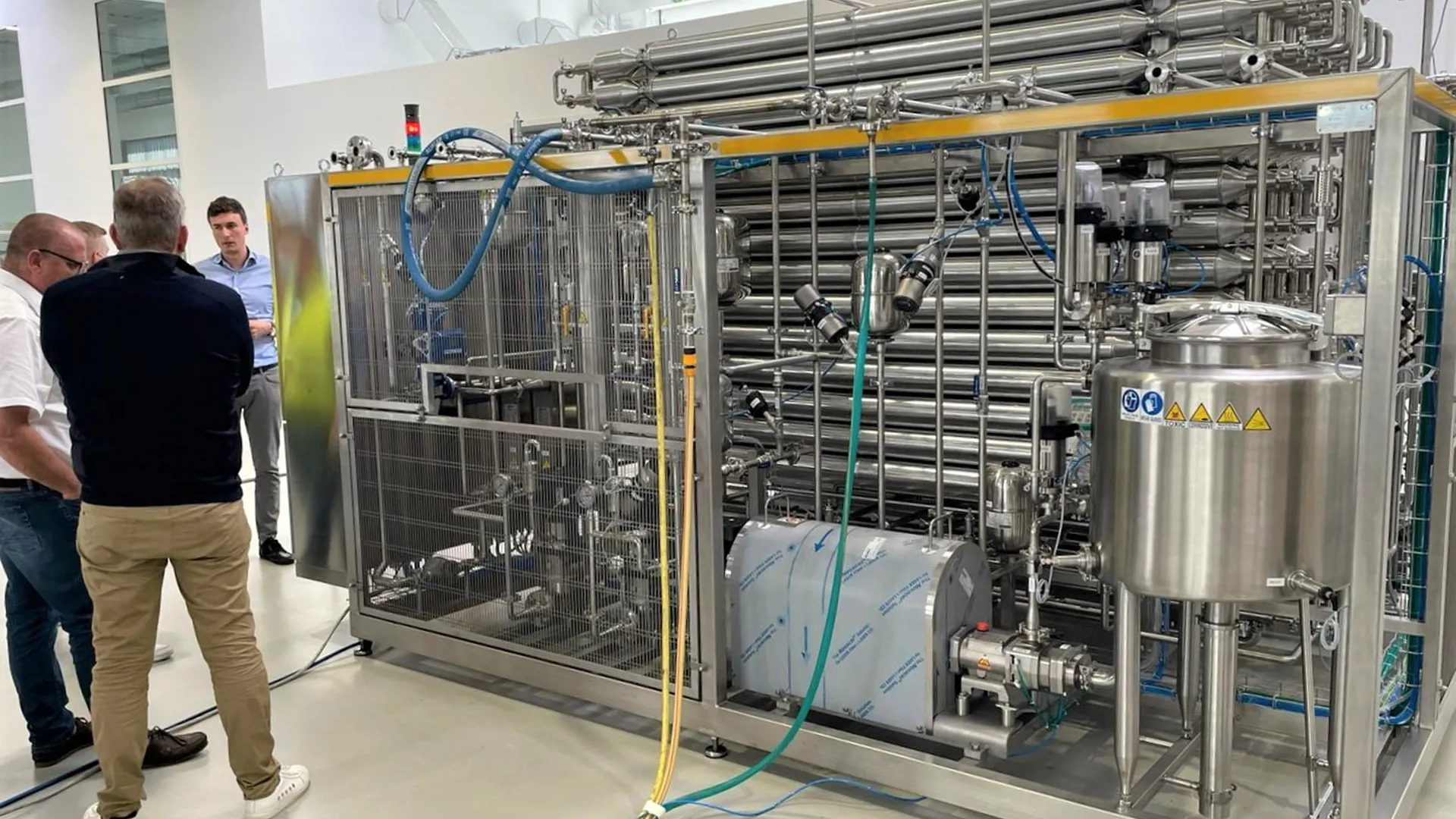 Training session on SANOVO WAVE pasteurization equipment with operators on site.