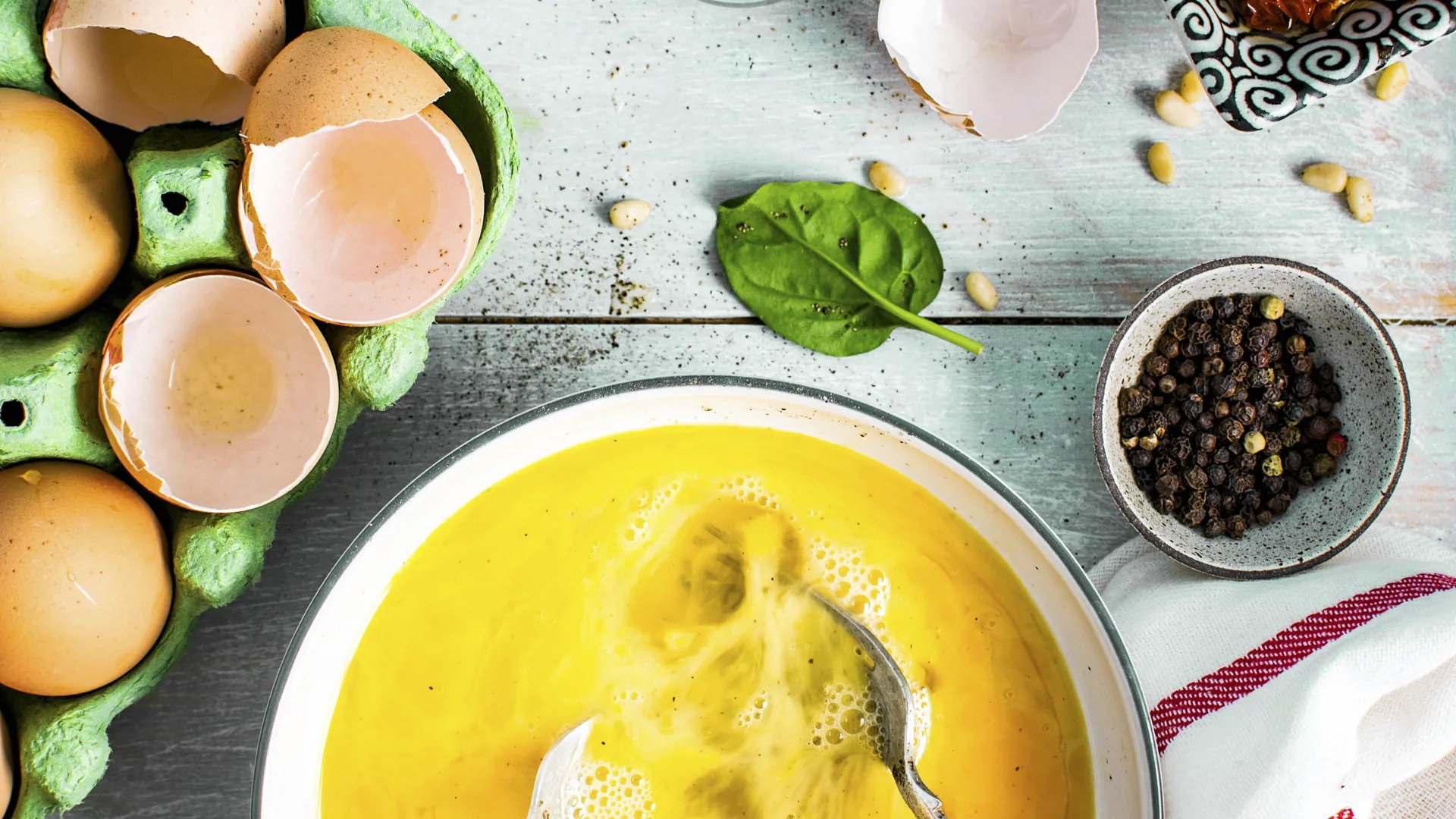 Fresh raw eggs in a cup