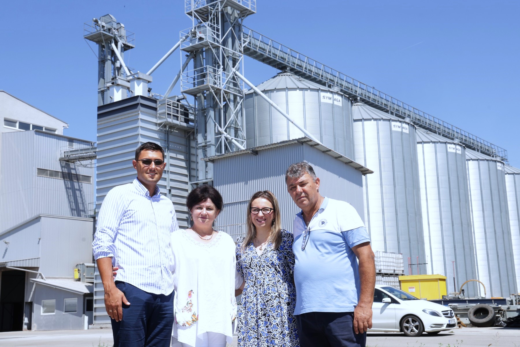 Rakic Komerc family team standing outside egg production and storage facilities.