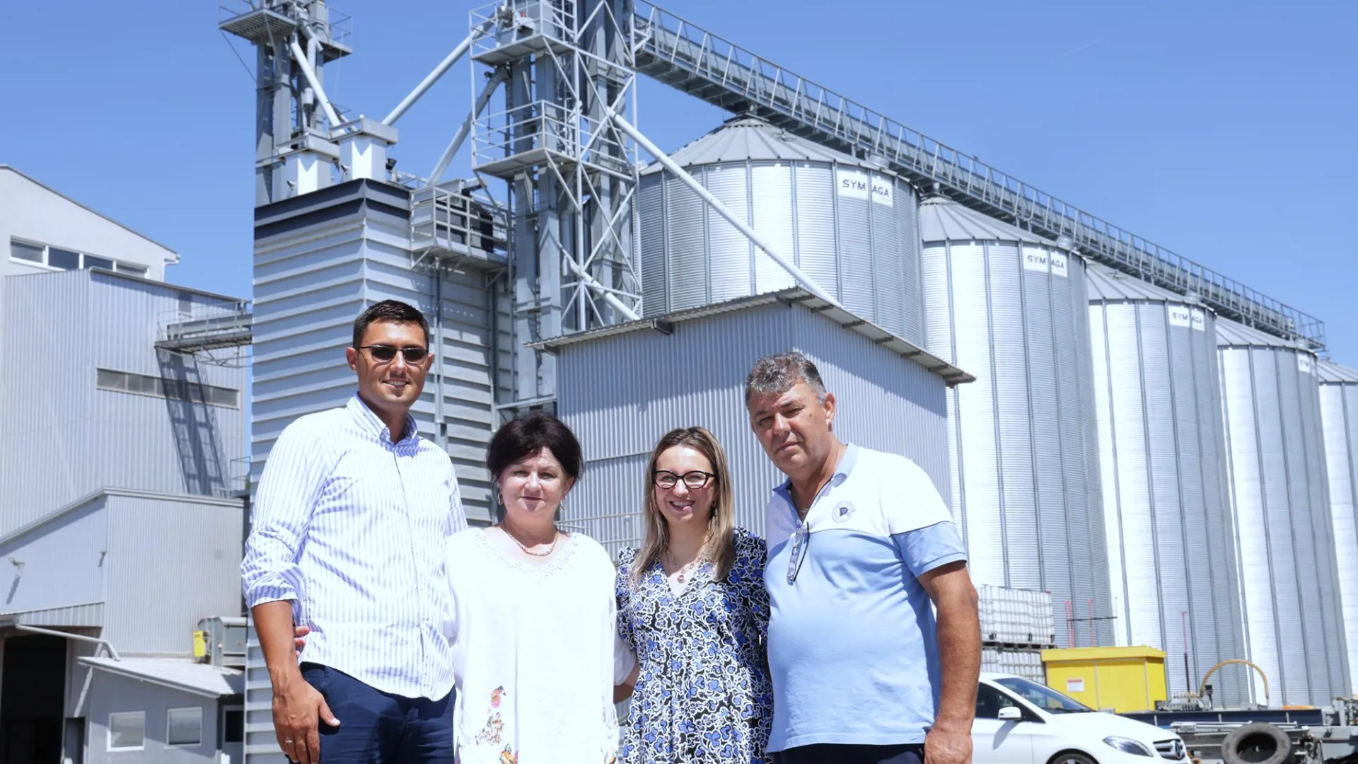 Rakic Komerc family team standing outside egg production and storage facilities.