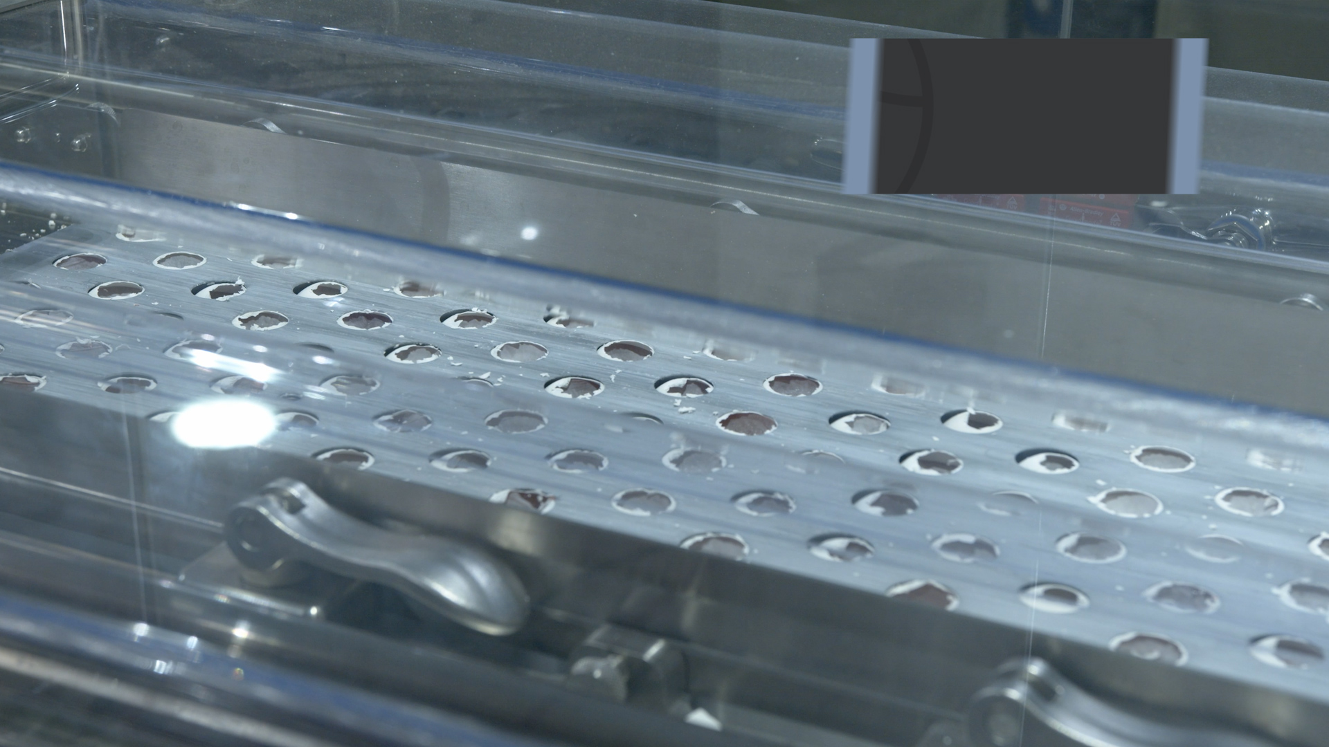 De-capping station of the RAME-HART Automatic Harvester removing eggshell tops and preparing access holes for inspection and harvesting.