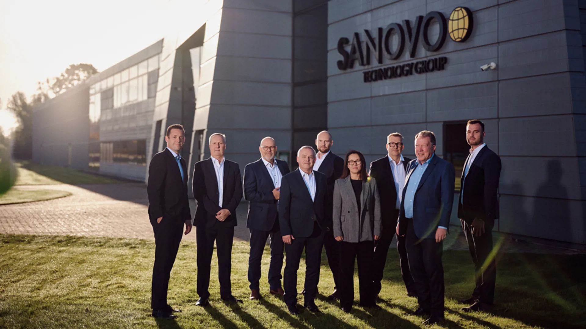 The top management of SANOVO TECHNOLOGY GROUP in front of the headquarters