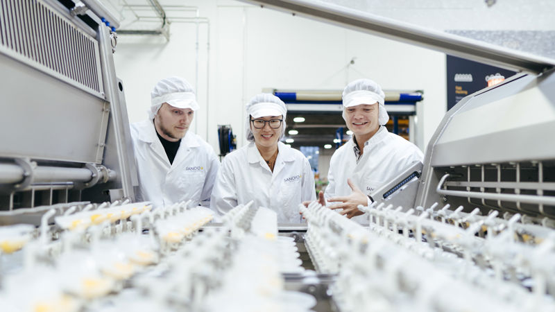 Team inspecting a SANOVO egg breaker machine