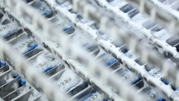 Wash down cleaning of the crack detection unit on a SANOVO egg grading machine.