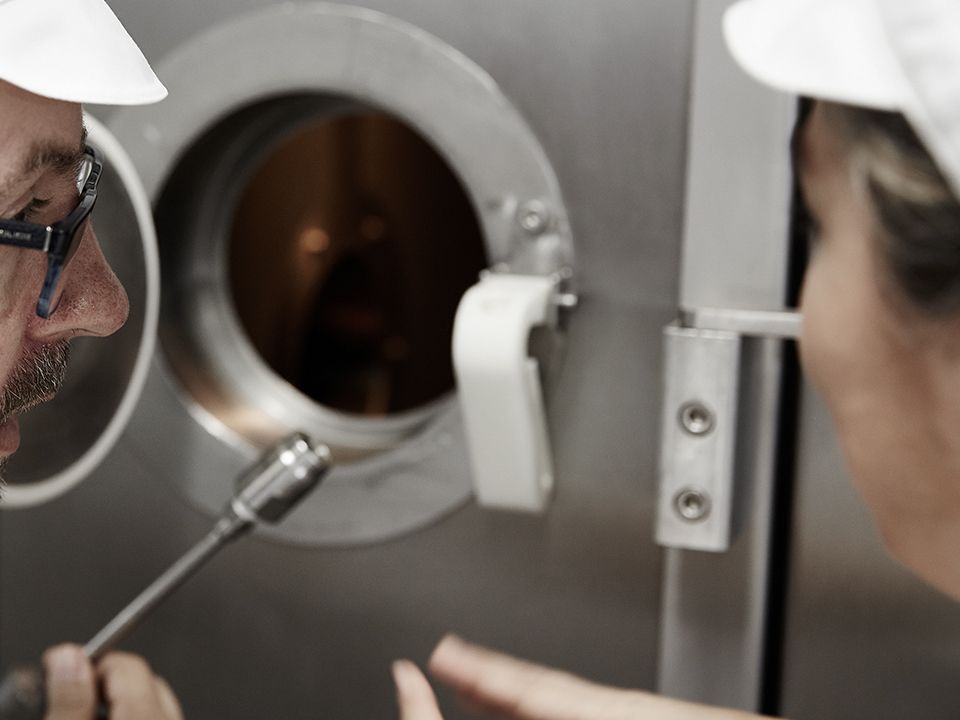 Close-up of the spray dryer drying chamber during inspection.