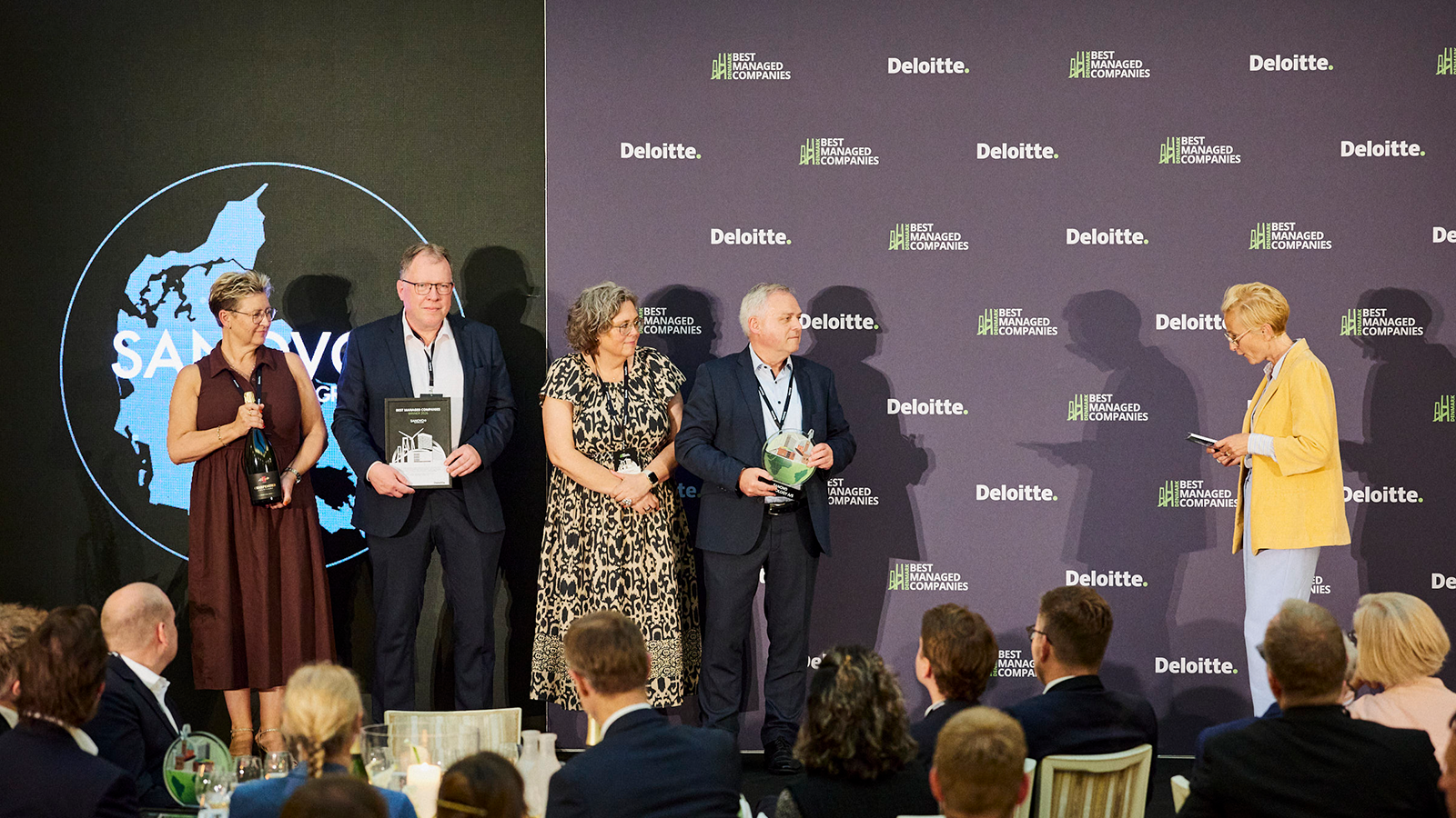 SANOVO team receiving Best Managed Companies 2026 Award on stage.