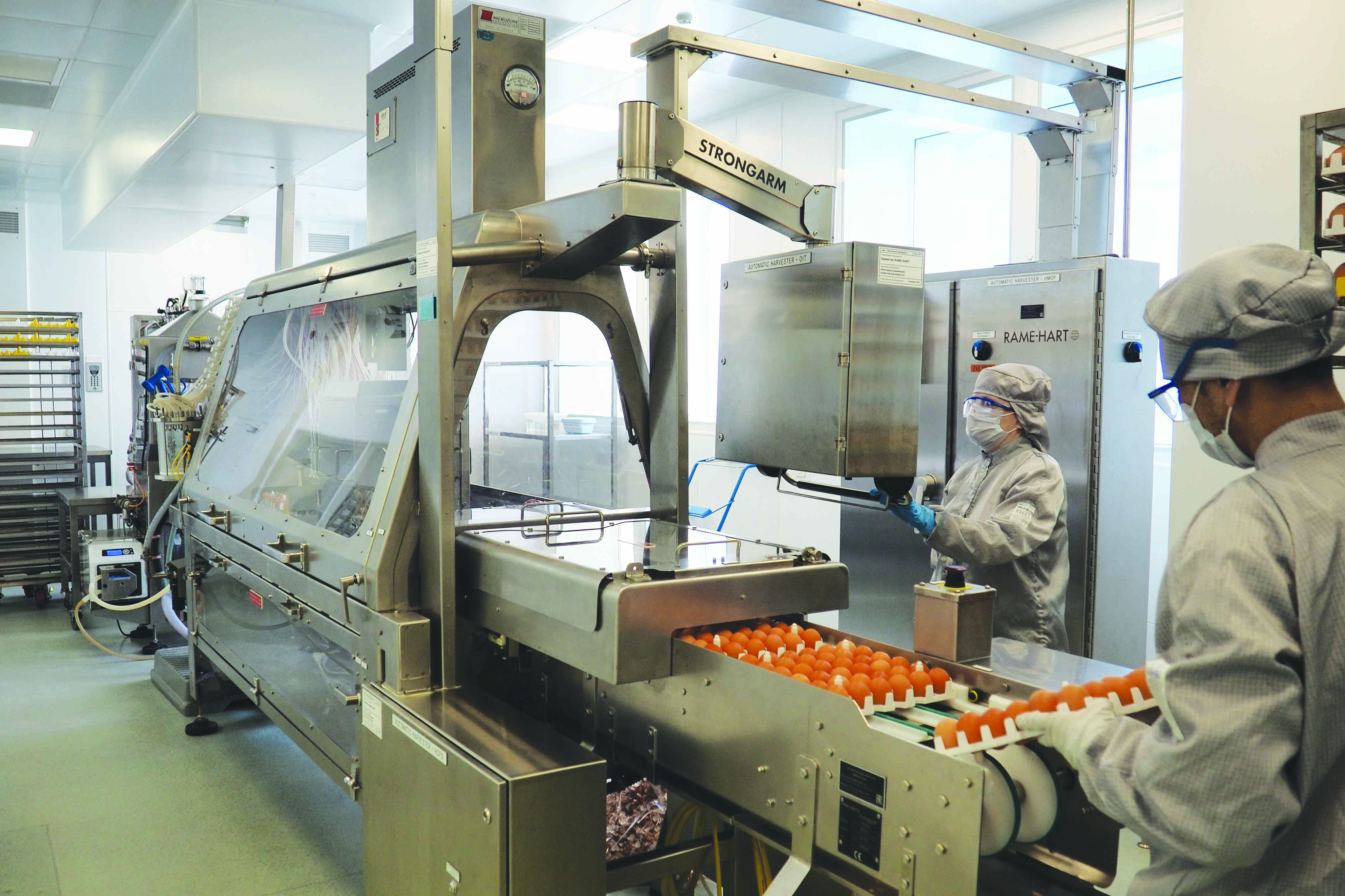 RAME-HART inoculator in operation with automated egg handling and controlled inoculation process.