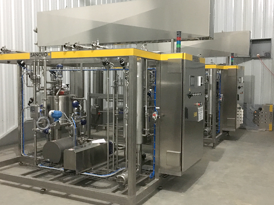 SANOVO liquid egg pasteurizer in an egg processing facility.