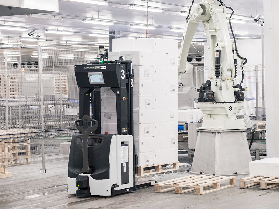 Model L-14 driverless forklift AGV for automated EUR-pallet transport in egg handling logistics in a facility.