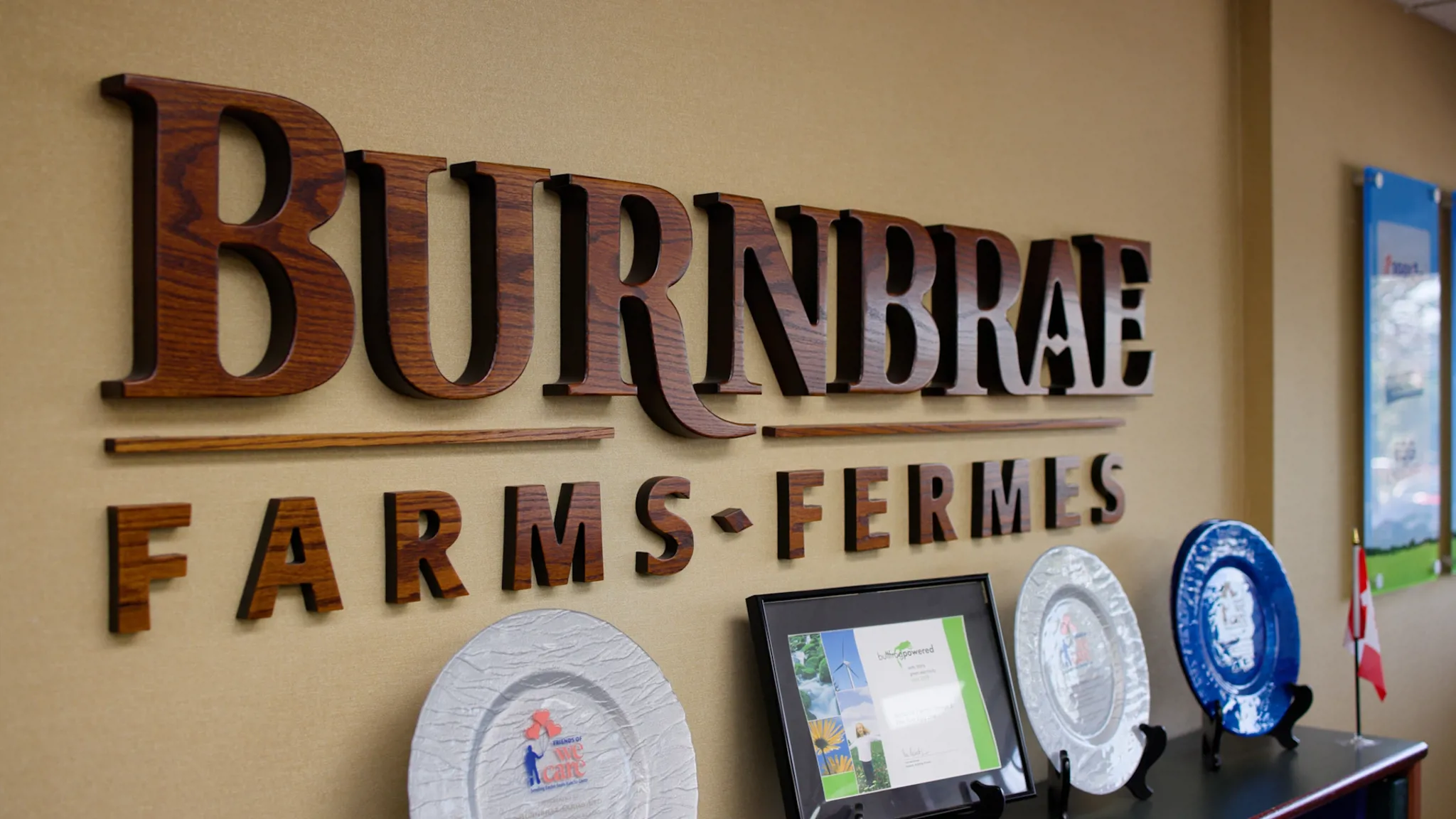 Burnbrae Farms office wall with company logo and awards.